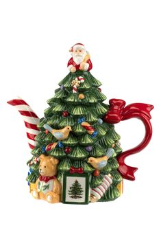 a ceramic christmas tree ornament with santa claus on top and other ornaments around it