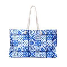 a blue and white tote bag on a white background