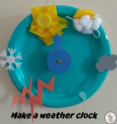 a paper plate that has some items on it and the words make a weather clock