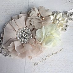 three flower hair clips on top of each other