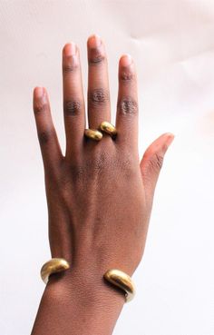 $14 SHIPS ALL ITEMS IN YOUR CART VIA DHL!Handcrafted in Nairobi, Kenya.A beautiful,unique brass cuff that is a must have for all!The cuff is adjustable and is in size Medium - Large.This listing is only for the cuff. ***SHIPPINGExpress shipping (via DHL) takes 2-4 WORKING DAYS to be delivered to you. Modern Brass Cuff Bangle, Modern Brass Cuff Bracelet, Brass Cuff Bracelet As Gift, Brass Cuff Bracelet Gift, Modern Brass Bangle Cuff Bracelet, Unique Brass Cuff Bracelets, Modern Brass Cuff Bracelets, Unique Brass Cuff Jewelry, Bronze Brass Cuff Jewelry