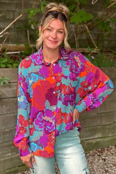 An exotic button down top with long sleeves and a collar around the neckline. It is a lightweight top with bright, fun, and unique colors and patterns. Style this top open with an orange tank and jeans for a groovy look. Ally is 5'7" and wearing her true size Small. Small: Bust 21", Length 27.5" 100% Rayon Top With Long Sleeves, Lightweight Tops, Denim Jumpsuit, Bottom Clothes, Cardigan Tops, Intense Colors, Small Bust, Unique Colors, Bottoms Pants