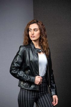 Upgrade your outerwear with our Black Women's Classic Fashionista Leather Jacket, available exclusively at LooksVillage. Crafted from premium sheepskin leather, this jacket combines rugged durability with sleek style. The Motorcycle design offers both warmth and comfort, while the full-length Zipper ensures a snug fit, perfect for chilly days. At LooksVillage, we pride ourselves on delivering high-quality products and exceptional customer satisfaction. We ship internationally, so no matter where Leather Coat Womens, Womens Black Leather Jacket, Sheepskin Jacket, Slim Fit Jackets, Retro Mode, Hottest Fashion Trends, Sleek Fashion, Black Leather Jacket, Leather Jackets Women