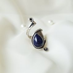 This 925 Sterling Silver adjustable wrap ring is purely handmade and Blue Goldstone (Sandstone), has a starry night sky view, is used. Crafted with meticulous attention to detail, our adjustable ring is designed to fit any finger, ensuring a perfect fit for everyone so it's an ideal gift option for yourself or your loved one!   Our Sterling Silver wrap ring, inspired by nature's wisdom, mirrors the transformative journey of the caterpillar within the cocoon, as it emerges into a beautiful butter Blue Sandstone Ring, Goldstone Ring, Sandstone Ring, Galaxy Nebula, Silver Wrap Ring, Blue Sandstone, Blue Goldstone, Sky View, Ring Stack