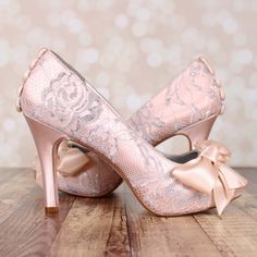 "Dress up your trip down the aisle with these 3 1/2\" custom wedding shoes (measured like this: http://www.customweddingshoe.com/about-ellie-wren/heel-height-measurement/). These shoes are shown in blush with a silver lace overlay, a hand made matching bow on the toe and hand made blush buttons on the back. Color Change: Want this shoe in a different color? We can change the base shoe color for you! To order this shoe in a different color, please send us a CUSTOM REQUEST. To view our catalogue o Vintage Inspired Wedding Shoes, Bow Wedding Shoes, Lace Wedding Heels, Simple Wedding Shoes, Blush Wedding Shoes, Dream Wedding Shoes, Lace Bridal Shoes, Heels Bow, Unique Wedding Shoes