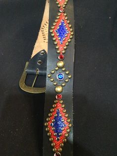 "1940s style black leather antique gold tone studded western biker belt. Two tone snakeskin inlay. Size 26\" waist ( 24\" to 28\" ) 1940s style western biker belt Made in Southern California these belts have been manufactured to the highest standard using impeccable craftsmanship. The belts are hand made with the period correct hardware and leather with either stingray, snake or lizard inlay. Classic Vintage black leather antique gold tone studded rockabilly western biker belt (features two tone Western Black Embroidered Belt, Black Western Style Embroidered Belt, Antique Black Belt Buckles For Festivals, Black Western Belt For Festivals, Western Black Belt For Festivals, Western Style Black Belt For Festivals, Gold Embroidered Leather Belt, Vintage Embroidered Festival Belt, Black Western Belt Buckles For Festival