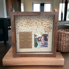 a wooden frame with two pictures in it and the words'auunt sarah'written on them