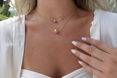 Meet Loretta! She classic, simple, cute, and make the perfect layer for your most stylish necklace collection. She is a must have! Hypoallergenic 8mm | 12mm 16" 18K Gold Plated over Sterling Silver Water and Tarnish Resistant Gold-tone Gold Plated Lariat Necklace, Gold Tarnish-resistant Layered Necklace, Elegant 14k Gold-filled Yellow Gold Beaded Necklaces, Elegant Gold-tone Layered Metal Necklace, Gold Lapis Lazuli Necklace With Faceted Beads, Silver Water, Necklace Collection, Stylish Necklace, Original Gift