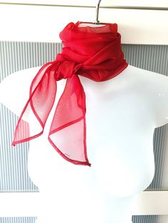 "Stylish red burgundy organza scarf with pointed ends from 70s. The scarf is long and can be used as a neck wrap, headband, sash, bag decor or any other piece of accessory to match your dress, shirt or jacket. The scarf is in excellent/mint condition and will make a beautiful gift. It comes in a gift wrap and with a \"Thank you' card. For more scarves in my store visit: https://www.etsy.com/ca/shop/NostalgicByLiliya?ref=seller-platform-mcnav&section_id=25031148 For other items visit: https://www Elegant Red Scarf For Formal Occasions, Elegant Red Silk Scarf For Party, Classic Red Silk Scarves, Classic Red Silk Scarf, Elegant Red Silk Scarf For Wedding, Party Scarves In Organza, Solid Color Silk Scarf For Formal Summer Occasions, Elegant Red Silk Scarf For Summer, Red Neck Scarf