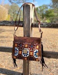 This bag is classic southwestern style. Meet Montana. She's a little different from the others: she's made of beautifully woven cloth and leather in these exquisite patterns that evoke the desert southwest. This purse can be used: Crossbody  Shoulder Bag  Approx Size: 14" x 9"  Strap: 52"  -100% genuine leather body with Aztec Saddle Blanket  -adjustable cross body strap with a buckle  -top zipper closure  -inside zipper pocket  -metal feet on the bottom for protection and stability -genuine Lea Southwestern Brown Rectangular Shoulder Bag, Southwestern Style Brown Rectangular Shoulder Bag, Brown Southwestern Rectangular Shoulder Bag, Brown Southwestern Style Shoulder Bag For Everyday Use, Southwestern Multicolor Bags For Everyday Use, Southwestern Style Tote Bag For Everyday Use, Multicolor Southwestern Bags For Everyday Use, Southwestern Multicolor Everyday Bags, Southwestern Style Everyday Tote Bag