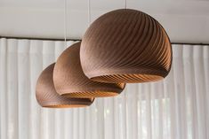 three wooden lights hanging from the ceiling