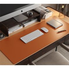 a computer desk with a keyboard and mouse