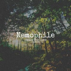 the words nemophile are written in white on a dark background surrounded by trees