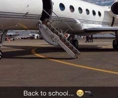 an airplane is parked on the tarmac with its door open and steps down to it