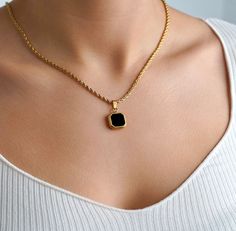 Luxury 18K Gold Onyx Necklace in either a Gold / Silver Charm Model is wearing a 20" chain. Created using real cuts of an onyx stone. Every stone is unique making this the perfect gift/ present. We have also added the option to purchase the black enamel pendant for those who want a cheaper option than the black onyx gemstone. If you select with a chain, the standard chain is a 22" rope chain. You can see in some of the images the pendant is on a different chain. If you would like a different cha Luxury Black Chain Necklace For Gift, Black Necklace With Gold Chain For Gift, Black Jewelry With Gold Chain For Gift, 18k Gold Necklace, Onyx Necklace, Black Onyx Stone, Onyx Gemstone, Cute Necklace, Necklace Black