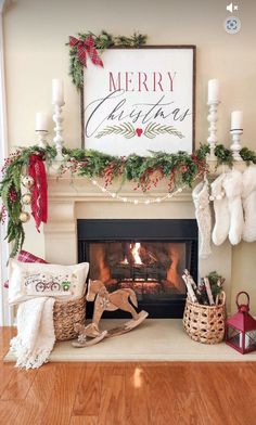 a fireplace decorated for christmas with stockings and stockings on the mantel above it is a merry sign