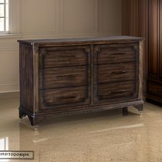 a large wooden dresser sitting on top of a hard wood floor next to a window