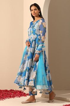 Blue anarkali crafted in organza in floral pattern. Paired with apant and soft net dupatta.
Components: 3
Pattern: Embroidered
Type Of Work: Lace
Neckline: Round
Sleeve Type: Long
Fabric: Anarkali: Organza, Pant: Cotton, Dupatta: Soft Net
Color: Blue
Other Details: 
Length:
Anarkali: 48 inches
Pant: 38 inches
Dupatta: 2.5 mtrs
Dupatta width: 44 inches
Occasion: Mehendi and Haldi - Aza Fashions Blue Lehenga With Printed Motifs For Eid, Eid Blue Lehenga With Printed Motifs, Blue Anarkali Lehenga With Floral Print, Unstitched Blue Anarkali Set With Printed Motifs, Anarkali Sets With Floral Print In Organza, Organza Anarkali Sets With Floral Print, Anarkali Style Floral Print Dupatta For Party, Blue Anarkali Set With Floral Embroidery, Blue Floral Print Salwar Kameez For Wedding