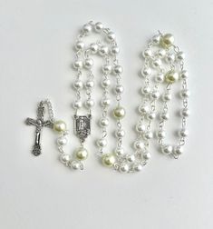 Handmade rosary was made with silver metal wire, 6mm white and 8mm light green faux glass pearls. Images of Our Lady on both sides of the rosary center piece. Comes in a gift pouch Green Rosary, White Rosary, Red Stone Necklace, January Birthstone Necklace, November Birthstone Necklace, Handmade Rosary, Pearl Rosary, Citrine Jewelry, Yellow Gemstones