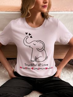 Trunkful of Love Tshirt, Elephant Lover Shirt, Cute Elephant Shirt, Elephant Shirt This classic unisex jersey short sleeve tee fits like a well-loved favorite. Soft cotton and quality print make users fall in love with it over and over again. These t-shirts have-ribbed knit collars to bolster shaping. The shoulders are tapered for a better fit over time. Dual side seams hold the garment's shape for longer.  Made with 100% Airlume combed and ring-spun cotton, a lightweight fabric that is easy to Valentine's Day Graphic Print Short Sleeve T-shirt, Trendy Valentine's Day Crew Neck T-shirt, Trendy Crew Neck T-shirt For Valentine's Day, Short Sleeve Tops With Heart Graphic, Trendy Valentine's Day T-shirt With Letter Print, Casual Valentine's Day Tops With Letter Print, Short Sleeve T-shirt With Heart Graphic, Casual Valentine's Day Top With Text Print, Casual Tops With Letter Print For Valentine's Day