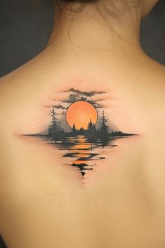 the back of a woman's neck with a sunset and pine trees on it