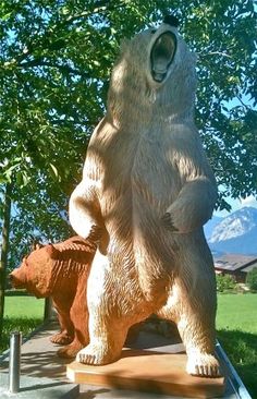 a statue of a bear standing next to another bear