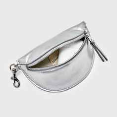 Carry your on-the-go items securely in this Belt Bag Pouch Wristlet from Universal Thread™. This pouch wristlet belt bag features a single compartment secured by a zip closure for carrying anything from small makeup accessories, keys, cards or jewelry. An on-trend complement to a variety of outfits, it comes with a D-ring to let you attach a strap to give you more carrying options. Universal Thread™: Found exclusively at Target. Functional Crossbody Pouch With Zipper Closure, Trendy Pouch With Zipper Pocket For Everyday Use, Versatile Coin Purse With Interior Key Chain Holder, Removable Pouch Coin Purse For On-the-go, Trendy Travel Coin Purse With Removable Pouch, Trendy Travel Coin Purse With Zipper, Trendy Travel Zipper Coin Purse, Trendy Pouch Clutch With Zipper Pocket, Trendy Clutch With Zipper Pocket