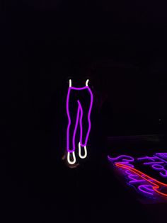 a neon sign that is in the dark