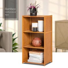 a wooden shelf filled with books next to a vase and potted plant on top of it