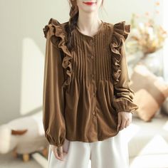 27 Casual Brown Blouse For Winter, Brown Ruffled Blouse For Fall, Brown Ruffled Blouse For Work, Chic Brown Ruffled Blouse, Casual Brown Ruffled Blouse, Casual Brown Blouse With Ruffles, Brown Ruffled Blouse For Spring, Beige Ruffled Tops For Fall, Fall Beige Ruffled Tops