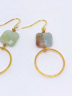 Handmade in Portland, Oregon. This will make the perfect gift! Or, definitely get it for yourself, I support that, too. MEASUREMENTS + MATERIALS - Length is about 1.5 inches - Pretty raw aquamarine gemstone - Hoop is about 1 inch in diameter - Gold fill ear wire for sensitive skin (hypoallergenic) WHAT PEOPLE SAY “Beautiful craftsmanship, these were for my mother in law, she loves them. I love supporting small businesses.” - Josh “ Love these earrings!! I get so many compliments about them when Handmade Gold Aquamarine Earrings, Minimalist Gold Aquamarine Jewelry, Gold Aquamarine Gemstone Earrings, Handmade Aquamarine Round Jewelry, Aquamarine Round Jewelry With Matching Earrings, Aquamarine Matching Earrings Jewelry, Gold Aquamarine Round Jewelry, Round Aquamarine Gold Jewelry, Handmade Modern 14k Gold Filled Jewelry