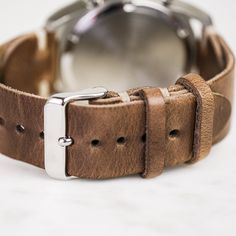 Our classic 2-piece custom watch straps feature Horween Leather in multiple color options with natural stitching. Straps feature a thumbnail style buckle and leather strap stays. As you wear your strap, you will notice how quickly it breaks in and molds to your wrist creating an incredibly comfortable fit. And with daily wear, it will deepen in color and patina becoming a piece completely unique to you.• Handmade watch band in Horween Leather• Simple stitching in Natural waxed polyester thread• Adjustable Leather Watch Bands For Business, Leather Watches With Bracelet Strap For Everyday Use, Timeless Leather Strap Watch Accessories For Everyday Use, Adjustable Leather Watches For Everyday, Masculine Leather Watch Accessories For Business, Classic Everyday Leather Bracelet, Classic Leather Strap Watch Bands For Everyday Use, Classic Leather Watch Bands For Everyday, Modern Leather Strap Watch Bands For Everyday