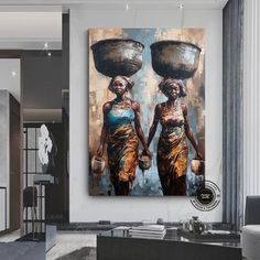 two women carrying pots on their heads in a living room with white walls and flooring