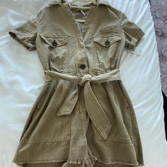 Never Worn With Tags, Super Cute Tan/Army Green Denim Romper Khaki Cotton Jumpsuits And Rompers For Fall, Beige Overall Bottoms With Pockets, Utility Cotton Khaki Jumpsuits And Rompers, Casual Brown Overalls, Khaki Cotton Jumpsuit With Pockets, Khaki Cotton Jumpsuits And Rompers With Pockets, Casual Khaki Jumpsuits And Rompers For Fall, Casual Khaki Cotton Jumpsuits And Rompers, Beige Cotton Jumpsuits And Rompers For Fall