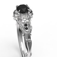 "To see my collection of Skull themed rings, click here: https://www.etsy.com/shop/MetalWendler?ref=seller-platform-mcnav&search_query=skull Beautifully crafted Art Nouveau style filigree skull engagement ring. Actual ring may vary slightly as they are finished by hand, but final rings are very, very close to what you see in the images. See my reviews for customer reactions to rings. This ring features a ~4.8mm round Black Diamond center stone. Message us about a custom idea! Free Shipping w Elegant Skull Ring As Gift, Elegant Skull Ring For Anniversary, Gothic Anniversary Ring With Intricate Design, Elegant White Gold Skull Ring For Anniversary, Elegant Sterling Silver Skull Ring, Elegant Skull Ring Gift, Elegant White Gold Skull Ring For Promise, Elegant White Gold Skull Ring, Elegant White Gold Skull Promise Ring