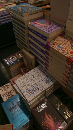 many books are stacked on top of each other