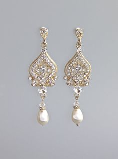 "The latest addition to our 'Lucy' range is the gold version of our popular earring which has such an elegant and classy style. They have a super pop of sparkle whilst still fitting the 'vintage' theme. They will flatter your face no matter the shape of your jawline and ooze elegance and class. Every step you take makes them shimmer, and are very 'wedding photograph' worthy. Measurements: Length - 2.5\" ★Customise your earrings and choose your pearl color from the drop menu. Set in tarnish resis Elegant Yellow Gold Teardrop Earrings For Wedding, Ornate Gold Drop Bridal Earrings, Gold Pearl Drop Chandelier Earrings For Wedding, Gold Chandelier Earrings With Pearl Drop For Wedding, Ornate Gold Earrings For Wedding, Filigree Teardrop Dangle Earrings For Wedding, Filigree Dangle Teardrop Earrings For Wedding, Classic Pierced Chandelier Earrings For Wedding, Classic Wedding Chandelier Earrings, Pierced