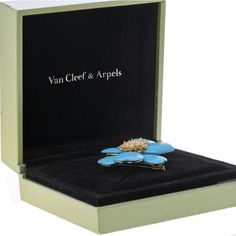 Experience the allure of timeless elegance in the Van Cleef & Arpels 18K Yellow Gold Turquoise Rose De Noël Large Model Brooch. Immerse yourself in the vibrant hues and meticulous craftsmanship that define this extraordinary piece. Crafted in exquisite 18K yellow gold, the brooch features captivating turquoise petals that exude a sense of luxury and sophistication. At the heart of this floral masterpiece, seven round diamonds sparkle brilliantly, adding a touch of brilliance to its radiant desig Luxury Turquoise Brooches, Luxury Turquoise Brooches For Gift, Turquoise Rose, Van Cleef And Arpels, Diamond Birthstone, Christmas Rose, Model Design, Van Cleef Arpels, Van Cleef