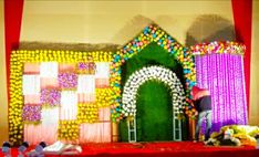 the stage is decorated with flowers and decorations