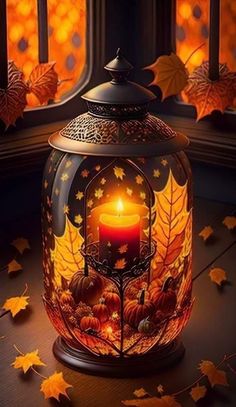 a lantern with a lit candle inside surrounded by autumn leaves