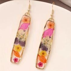 Brand New Boutique Earrings Material: 14k Plated Style Tags: Flowers, Floral, Stunning, Unique, Gift Pressed Flower Resin, Pressed Flower Earrings, Vintage Eyeglasses Frames, Versace Bright Crystal, Tan Belt, Rose Colored Glasses, Flower Resin, Silver Caps, Knitted Flowers