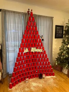 a christmas tree made out of red cups