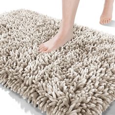 a person standing on top of a shaggy rug