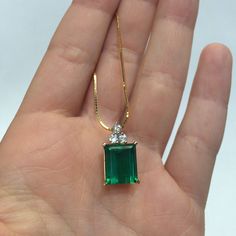 "This stunning emerald cut green stone pendant looks royal! Accompanied by 3 diamonds and hangs on a 14k gold box chain, this necklace will take a girls' breath away. 18\" box chain 14k gold 3 diamonds 3mm (apprx .10pts) each large emerald cut doublet green stone" Green Stone Pendant, Gold Box, 14k Gold Necklace, Green Stone, Stone Pendant, Box Chain, Emerald Cut, Stone Pendants, Necklace Etsy