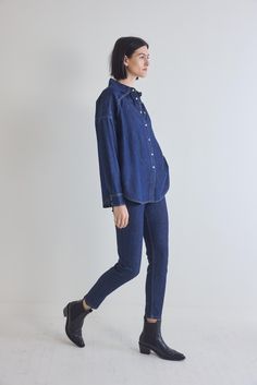 From laid-back weekends to casual outings, this tunic embodies effortless elegance. Revel in the sophistication of denim and embrace a look that effortlessly balances comfort and style. Oversized fit Collared Lightweight fabric Tunic style Classic Indigo Denim Top With Relaxed Fit, Oversized Denim Top For Workwear, Dark Wash Relaxed Fit Denim Top For Work, Oversized Dark Wash Denim Top For Everyday, Relaxed Fit Dark Wash Denim Top For Work, Relaxed Fit Dark Wash Denim Top, Classic Indigo Denim Top Relaxed Fit, Dark Wash Relaxed Fit Denim Top, Classic Indigo Relaxed Fit Denim Top