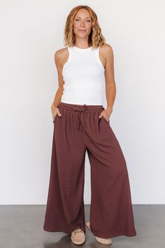 Baltic Born exclusive style The perfect wide-leg pants for traveling, work, or everyday style Puckered gauze-like material Muted warm Brown color Elastic waist with functional drawstring Slash pockets at hip Extra wide leg Marianne is 5'6, cup size 34D, size 6 and wearing size S Casual Brown Wide Leg Pants, Versatile Wide Leg Brown Pants, Brown Wide Leg Pants With Elastic Waistband, Bohemian Full-length Bottoms With Elastic Waistband, Versatile Brown Wide-leg Pants, Versatile Wide-leg Rayon Bottoms, Brown Versatile Wide-leg Pants, Brown Wide Leg Ankle-length Pants For Loungewear, Brown Ankle-length Wide Leg Pants For Loungewear