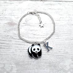 Super cute enamel panda charm bracelet perfect for any panda lover. Great little gift for kids or a present for mothers day. Perfect when ordered with my matching items that are available in my shop. *You can select the size from the drop down menu, available for children and adults. *The black and white enamel charm measures approximately 2cms long. *The charm, chain and other findings are silver plated. *These can also be personalised with initial charms which can be picked from the menu. ☆☆The bracelet comes presented in a gift bag but gift messages and  wrapping can also be purchased from my store.☆☆ If you have any questions or custom orders please feel free to message me. Panda Bracelet, Panda Charm, Animal Bracelet, Bracelet Cute, Personalised Jewellery, Charm Chain, Mothers Day Presents, Initial Jewelry, Fancy Jewelry