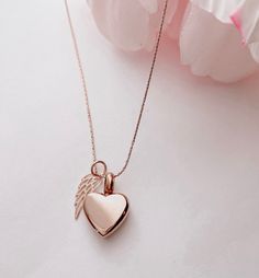 "Due to the very sensitive nature of this purchase, I will do everything I can to make the process simple and seamless. Please note that your piece will be made with much love and light ♥ DETAILS ♥ * Your beautiful keepsake will be made with a combination of Rose Gold Plating over stainless steel and Rose Gold Fill over Sterling Silver. * The heart urn pendant is Rose gold plating over stainless steel and is 5/8\" L by 1/2\"\" at the widest point * The elegant tiny wing pendant is Rose gold fill Rose Gold Heart Pendant Locket Necklaces, Dainty Rose Gold Heart Locket Necklace, Rose Gold Open Heart Jewelry For Wedding, Rose Gold Heart Locket Jewelry, Rose Gold Charm Necklace With Heart Pendant, Rose Gold Heart Pendant Charm Necklace With Delicate Chain, Elegant Rose Gold Heart Locket Necklace, Rose Gold Heart-shaped Locket Jewelry, Rose Gold Open Heart Locket Necklace