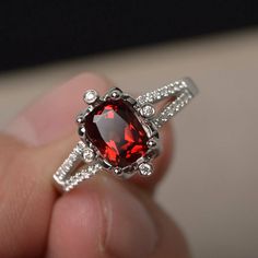 This is a gorgeous handmade creation. Its beauty is its simplicity & Elegance. The 6*8 mm cushion cut faceted natural Garnet is crafted in solid sterling silver and with rhodium plated. All item is sent in a beautiful gift box If you have any idea of design your ring,pls contact me directly. You can realize more lovely stuff clicking the link https://www.etsy.com/shop/knightjewelry?refshopsection_shophome_leftnav Please leave the correct address and you phone number for delivering successful Garnet Engagement Rings, Cushion Cut Rings, Garnet Wedding Rings, Citrine Ring Engagement, Garnet Wedding, Cut Rings, Marquise Cut Rings, Wedding Rings Art, Red Gemstone Ring