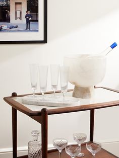 a table with glasses and a bowl on it